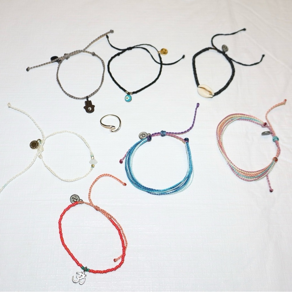 7 Pura Vida Bracelets and 1 Wave Ring